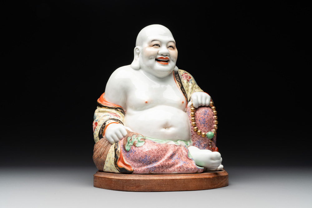 A large Chinese famille rose Milefo Buddha on wooden stand, 20th C.