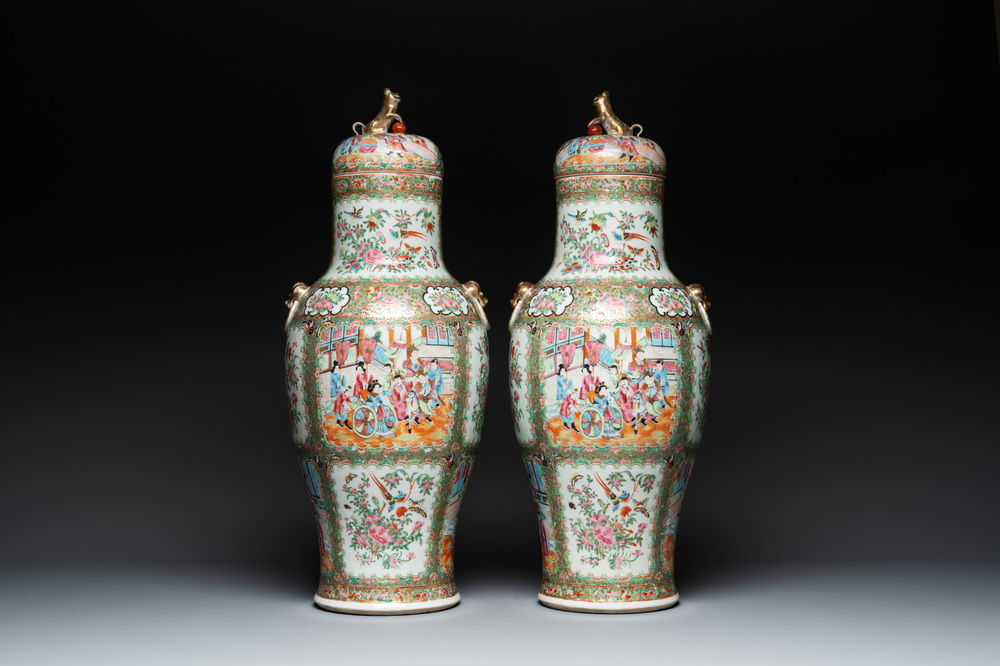 A pair of Chinese Canton famille rose vases and covers with narrative design, 19th C.