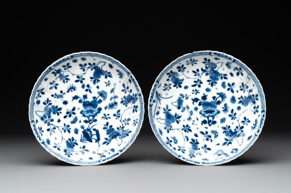 A pair of Chinese blue and white plates with floral design, Kangxi mark and of the period