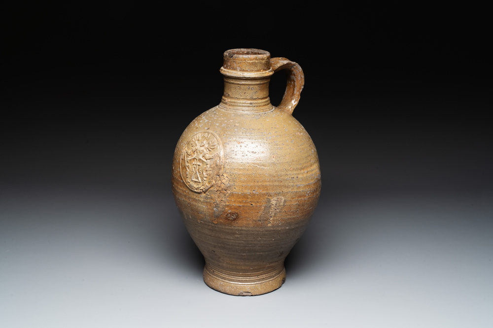 A Raeren stoneware jug, dated 1675