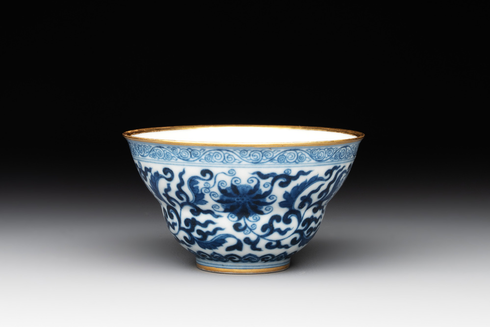 A Chinese gilt-decorated blue and white 'lotus scroll' bowl, Daoguang mark and of the period