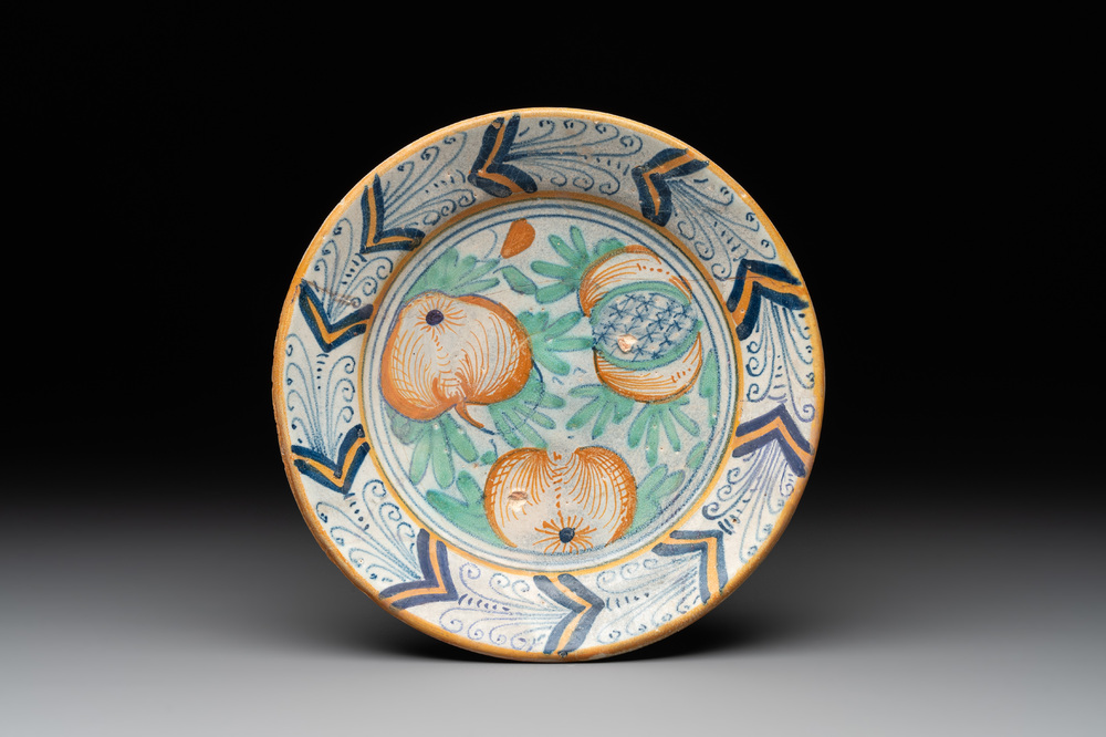 A polychrome Dutch maiolica 'pomegranates' plate, 1st half 17th C.