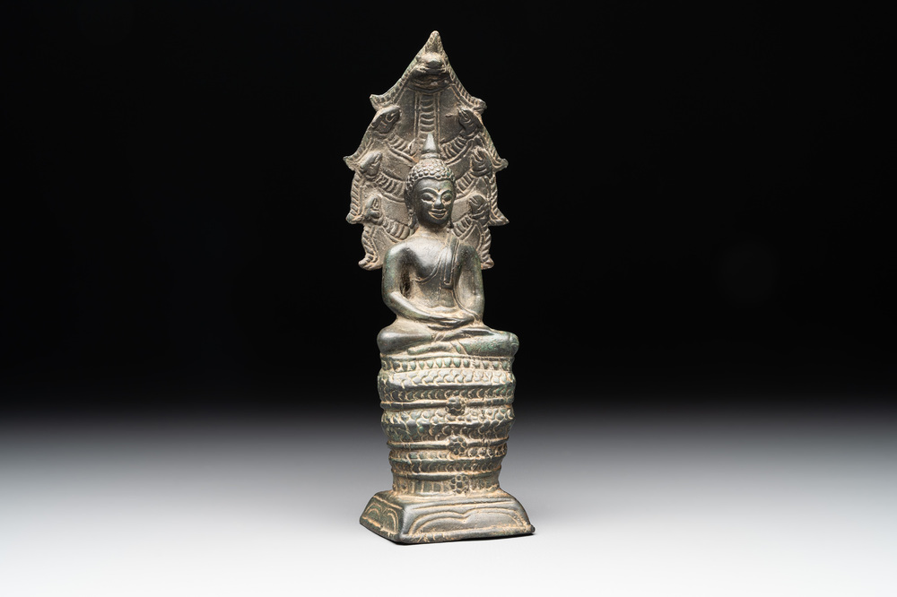 A Khmer bronze figure of Buddha Mucilinda, Angkor period, 12/13th C.