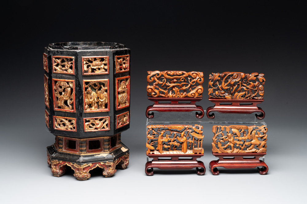 A Chinese octagonal gilt-lacquered wooden stand and four wooden carvings on stands, 19th C.