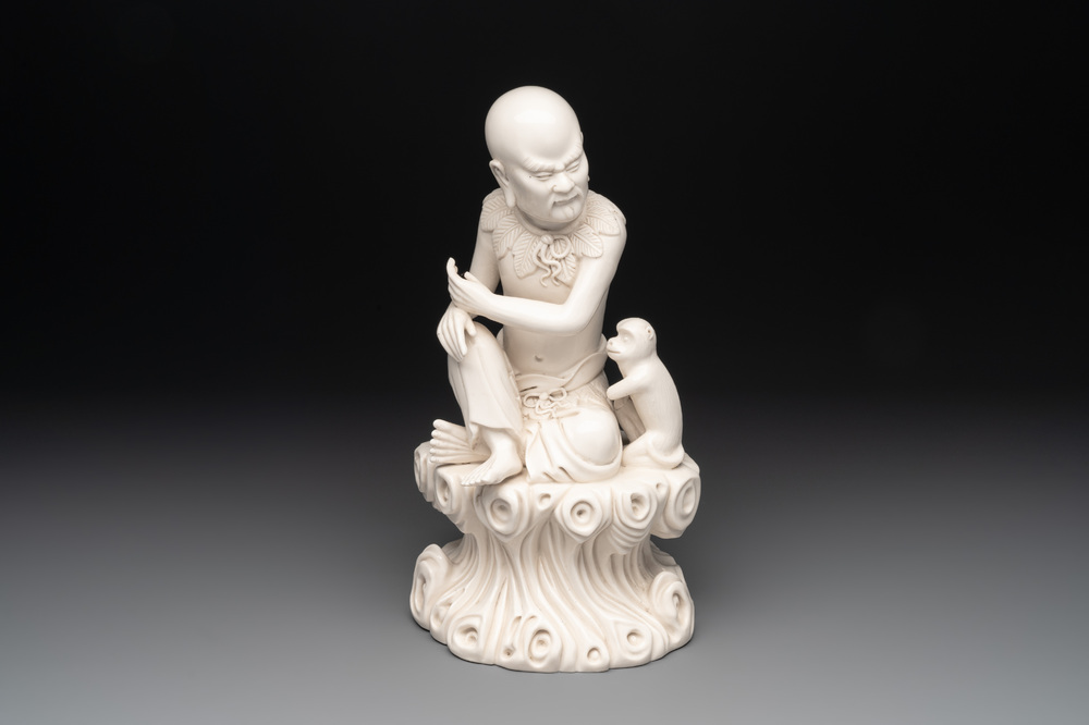 A Chinese Dehua blanc de Chine group of a seated Luohan with a monkey, 20th C.