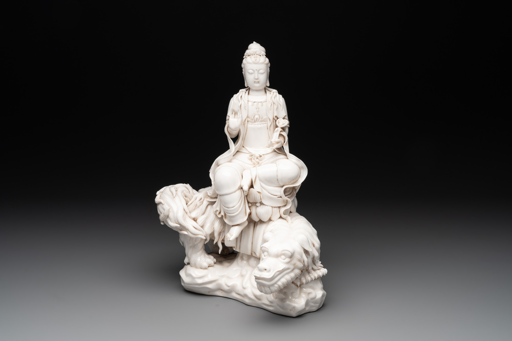 A Chinese Dehua blanc de Chine Bodhisattva seated on a Buddhist lion, 20th C.