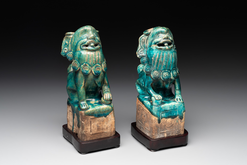 A pair of Chinese turquoise-glazed Buddhist lions on stands, probably Swatow kilns, 19th C.