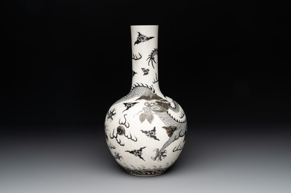 A Chinese black-enamelled  biscuit 'dragon' vase, Qianlong mark, 19th C.