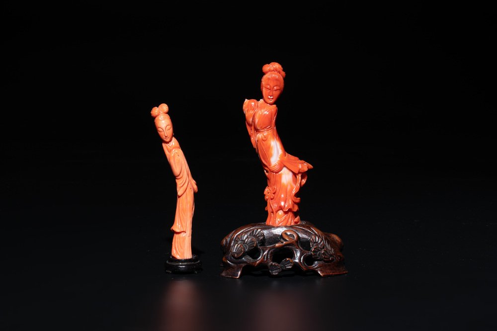 Two Chinese red coral sculptures of ladies on wooden stand, 19/20th C.