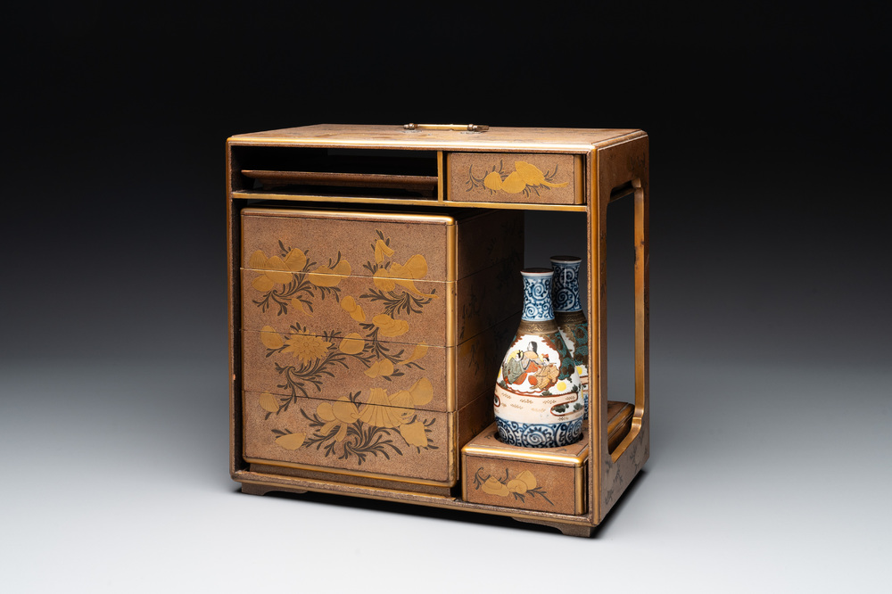 A Japanese lacquerware picnic set with two sake bottles, Meiji, 19th C.