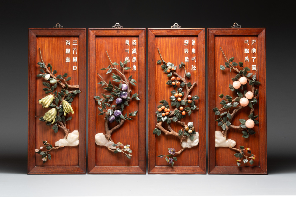 A set of four Chinese wooden panels with precious stones, 20th C.