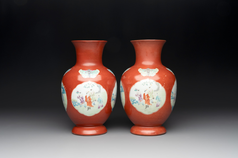 A pair of Chinese famille rose coral-red-ground vases with playing boys, 18/19th C.