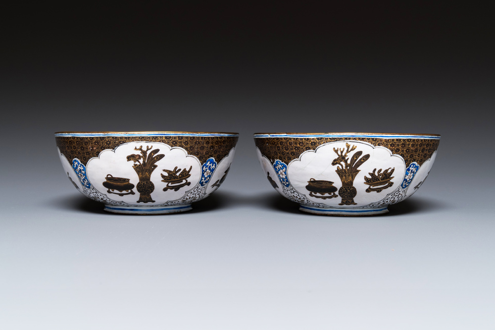 A pair of Chinese Canton enamel 'antiquities' bowls, Yongzheng/Qianlong