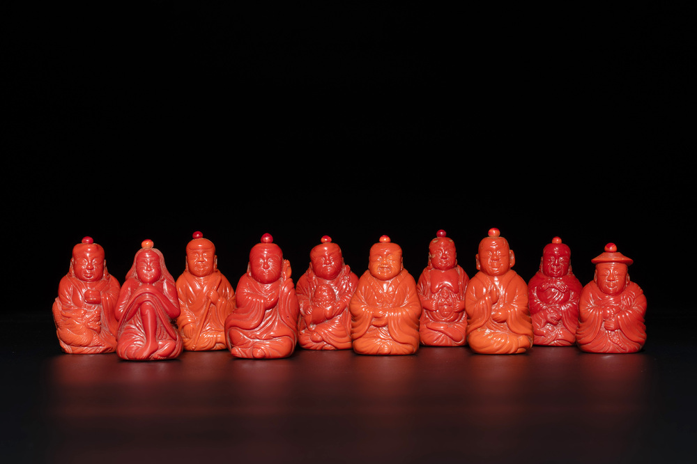 A set of ten Chinese coral-red glass Luohan-form snuff bottles, 20th C.