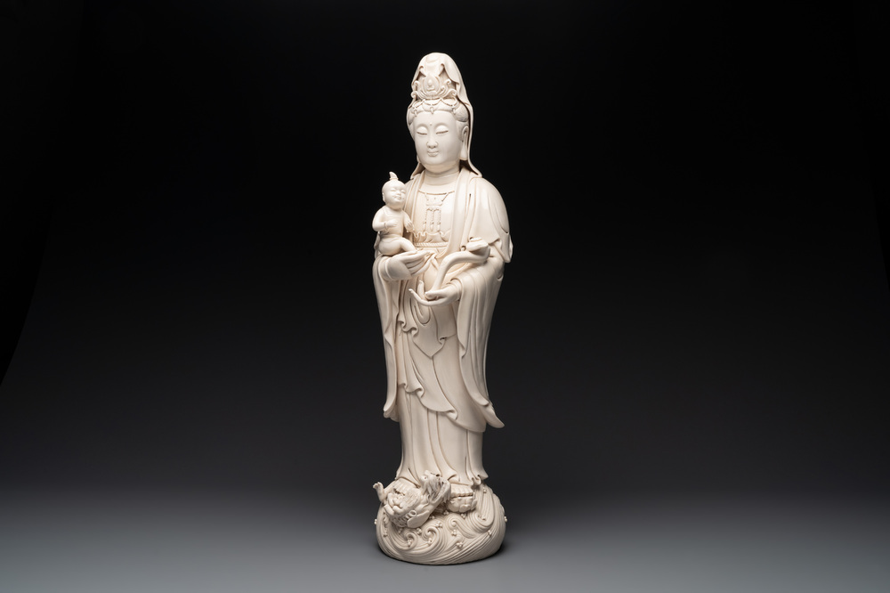 A large Chinese Dehua blanc de Chine group of a Bodhisattva with child, 20th C.