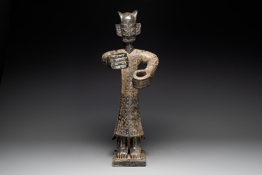 A large Chinese Sanxingdui-style marble sculpture of a standing figure, 20th C.