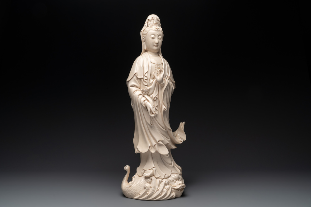 A large Chinese Dehua blanc de Chine Guanyin with a ruyi, 20th C.