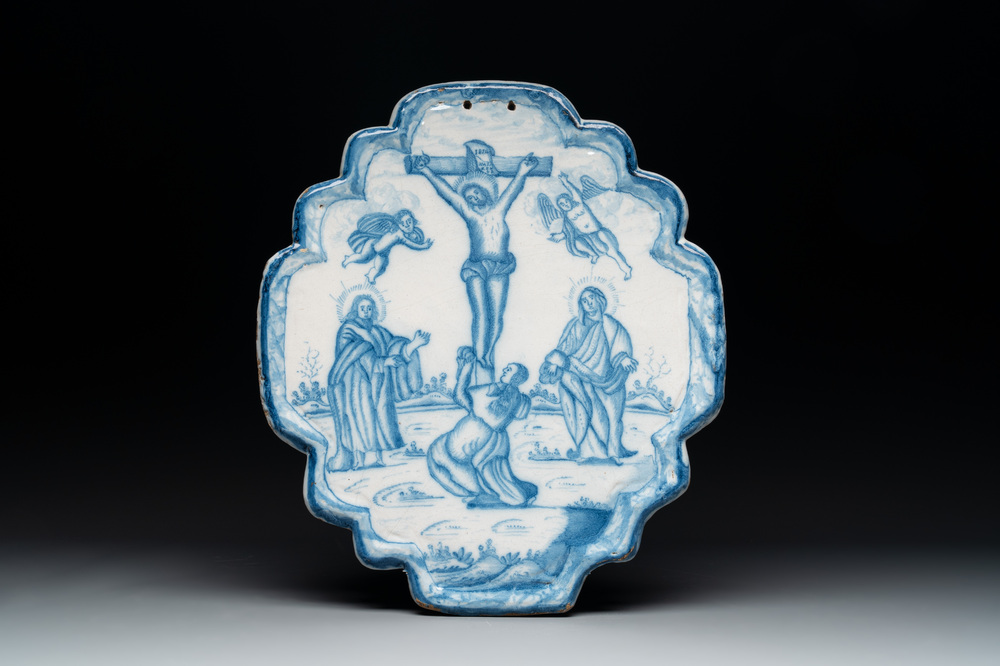 A blue and white Dutch Delft 'Crucifixion' plaque, 18th C.