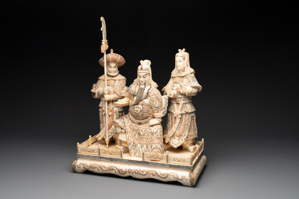 A Chinese bone-veneered group of Guandi and his attendents, 20th C