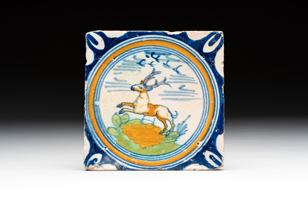 A polychrome Dutch Delft maiolica 'stag' ​​medallion tile, late 16th C.