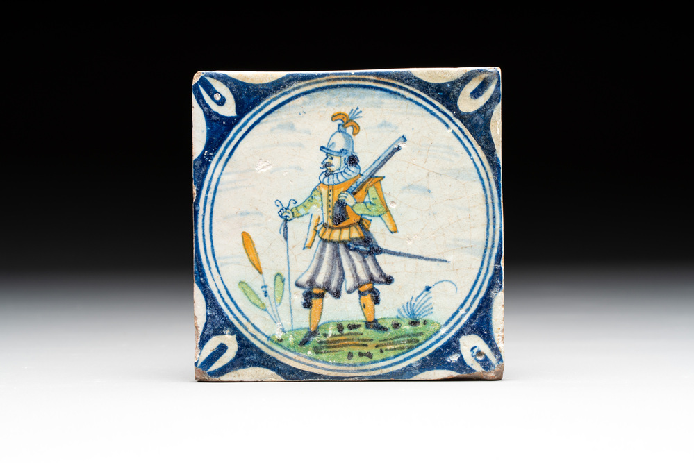A polychrome Dutch Delft maiolica 'soldier' medallion tile, late 16th C.