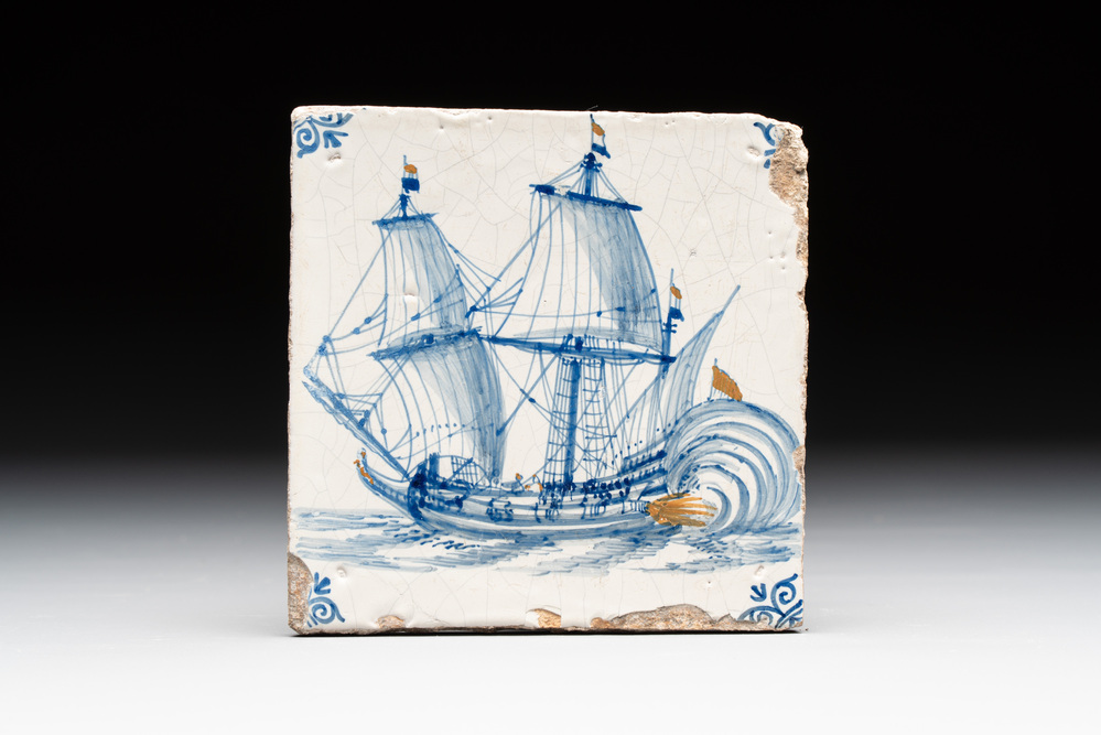 A blue and white Dutch Delft 'firing three-master' tile with coloured details, 17th C.