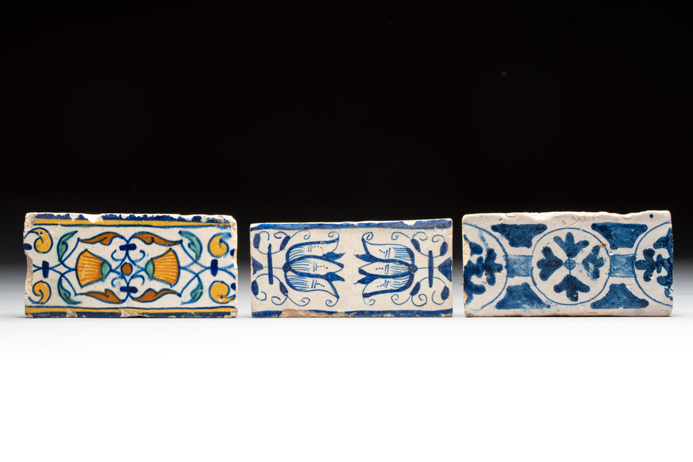 Two blue-white and one polychrome Dutch Delft 'border' 'ornamental' tiles, ca. 1600