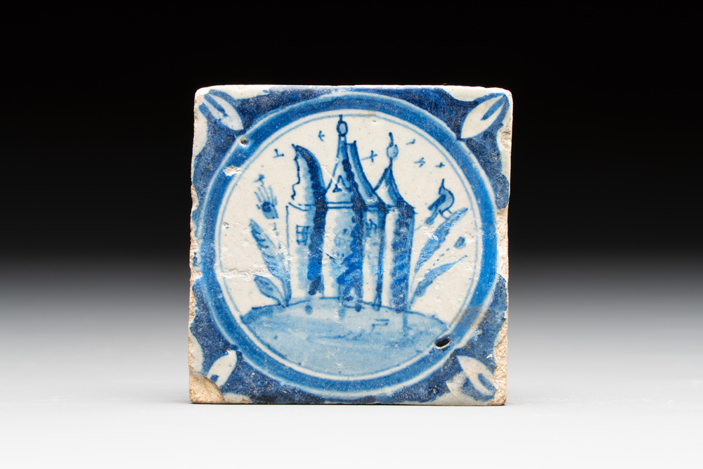 A small blue and white Dutch Delft 'castle' medallion tile, late 16th C.