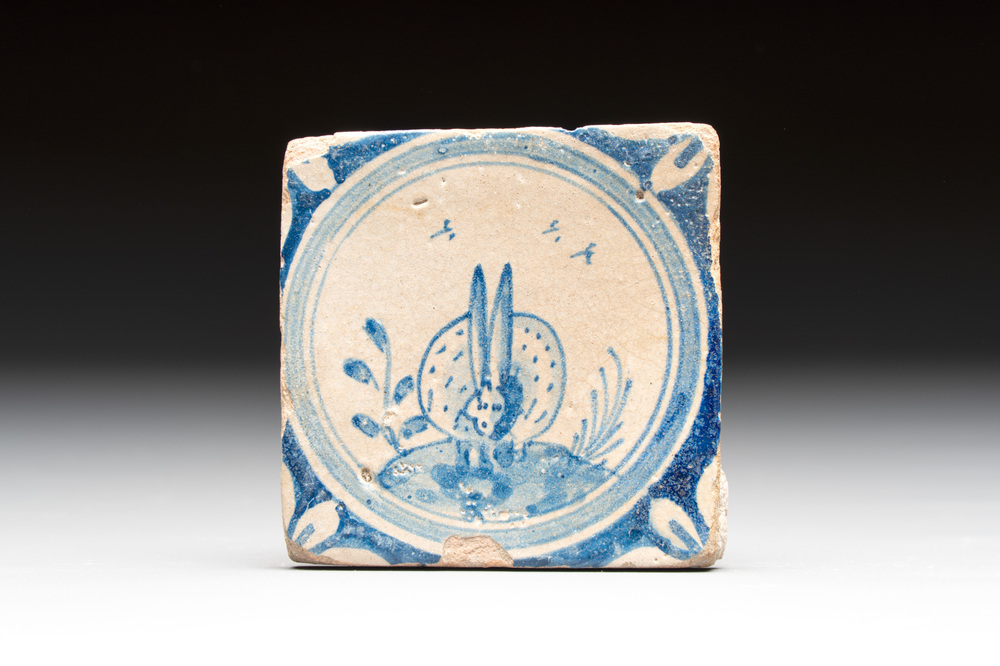 A small blue and white Dutch Delft 'rabbit' medallion tile, late 16th C.
