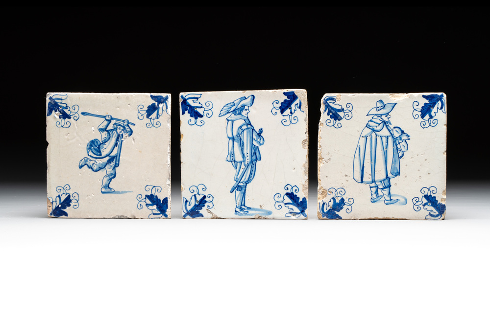Three blue and white Dutch Delft tiles with oak leaf corners, 17th C.
