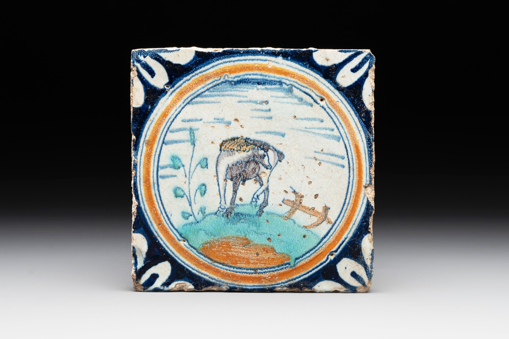 A polychrome Dutch Delft maiolica 'horse' medallion tile, late 16th C.
