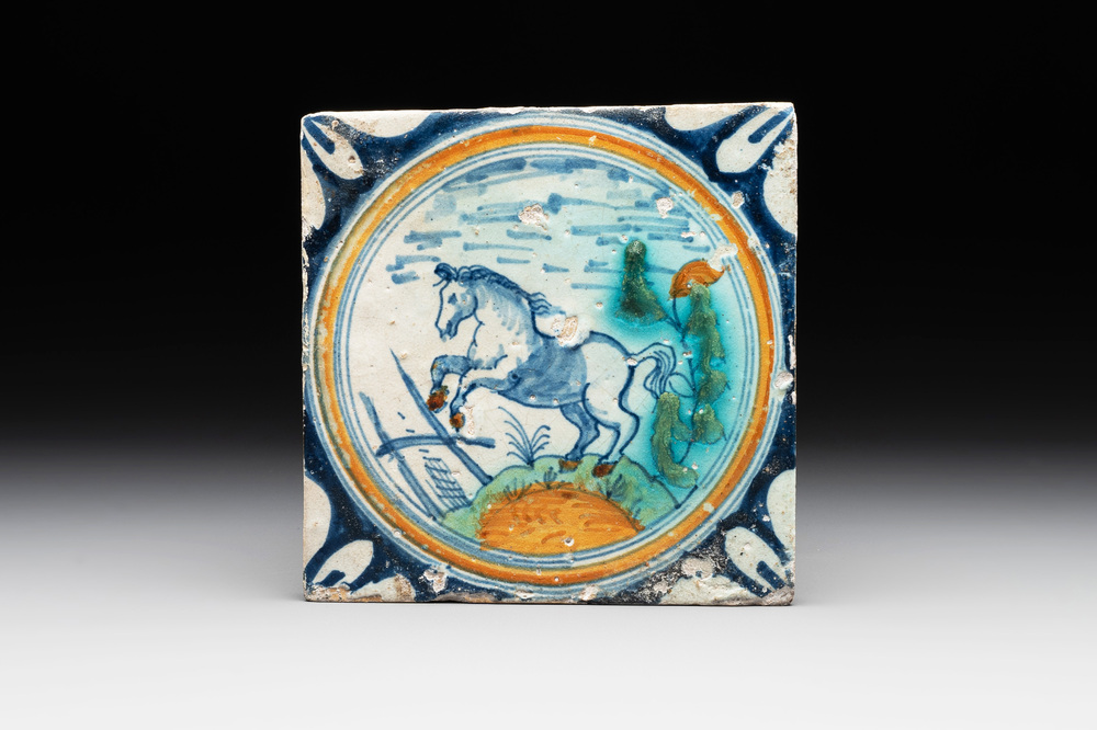 A polychrome Dutch Delft maiolica 'horse' medallion tile, late 16th C.