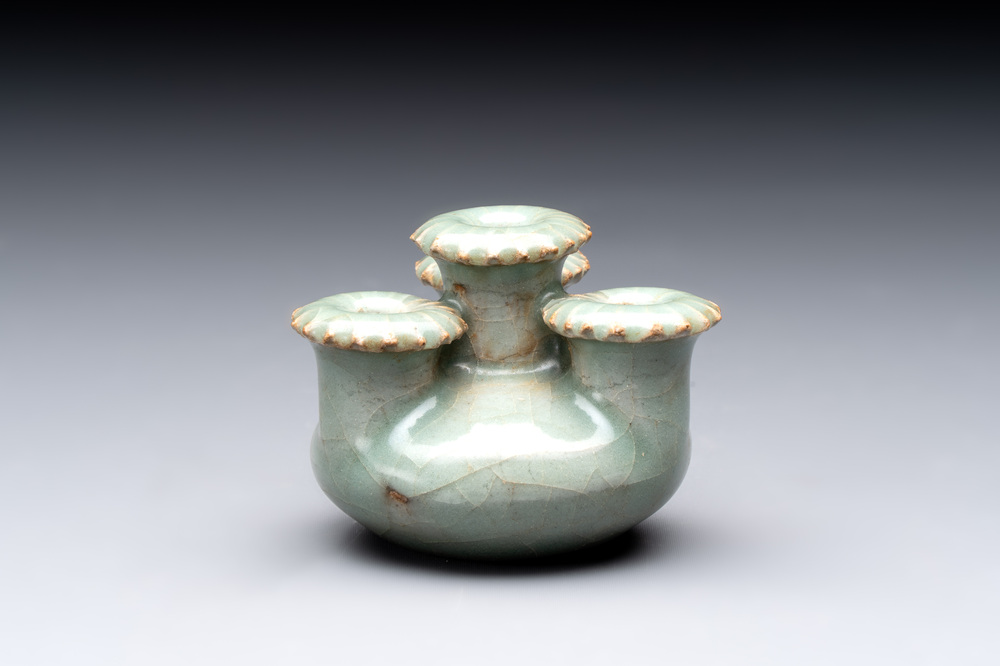 A small and rare Chinese Longquan celadon quadruple-neck vase, Song/Yuan