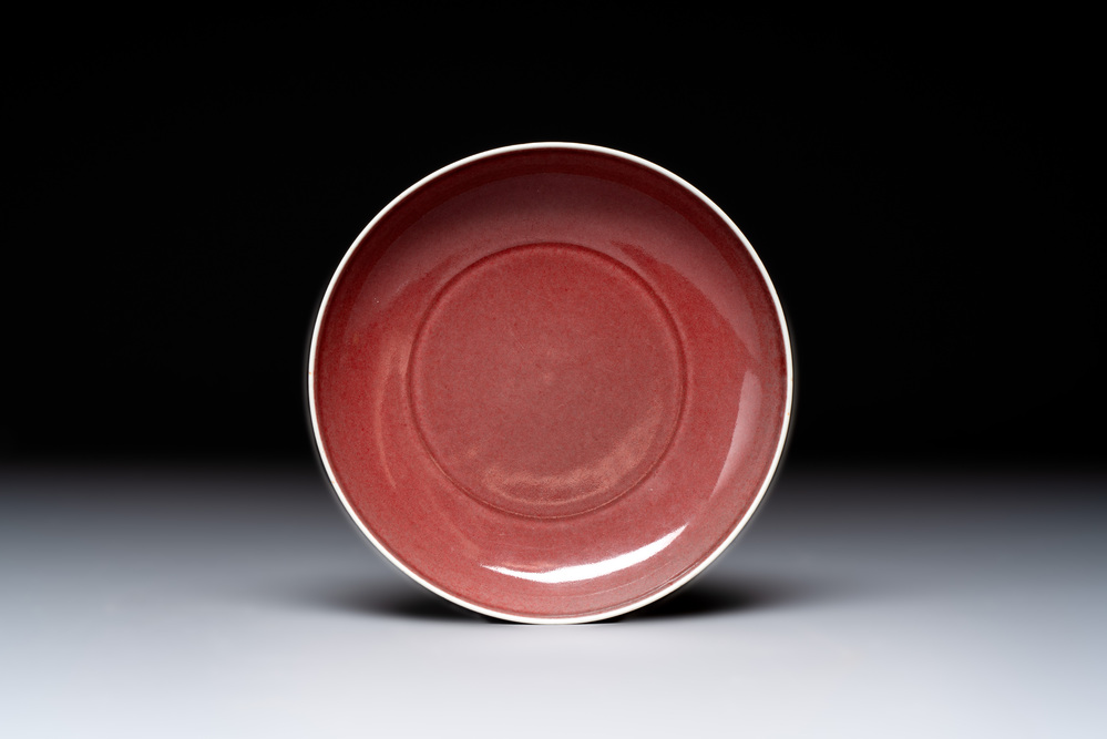 A Chinese copper-red glazed plate, Kangxi mark, 19/20th C.