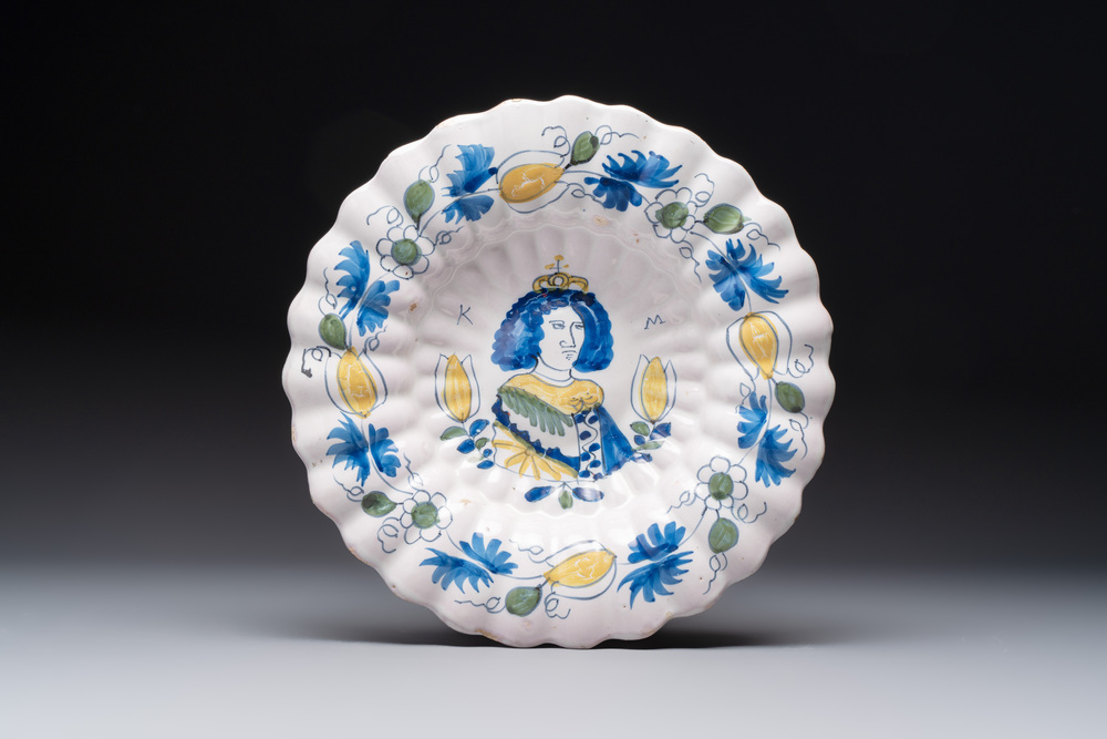 A polychrome Dutch Delft 'Queen Mary' dish inscribed 'K M', 17th C.