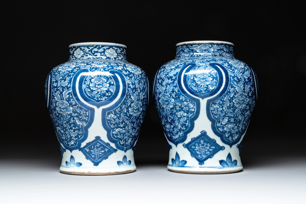 A pair of Chinese blue and white 'peony scroll' vases, Kangxi