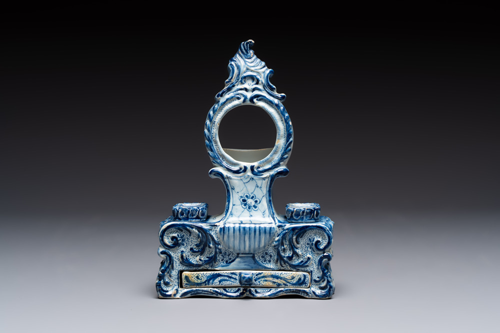 A blue and white Dutch Delft inkwell with pocket watch holder, 18th C.