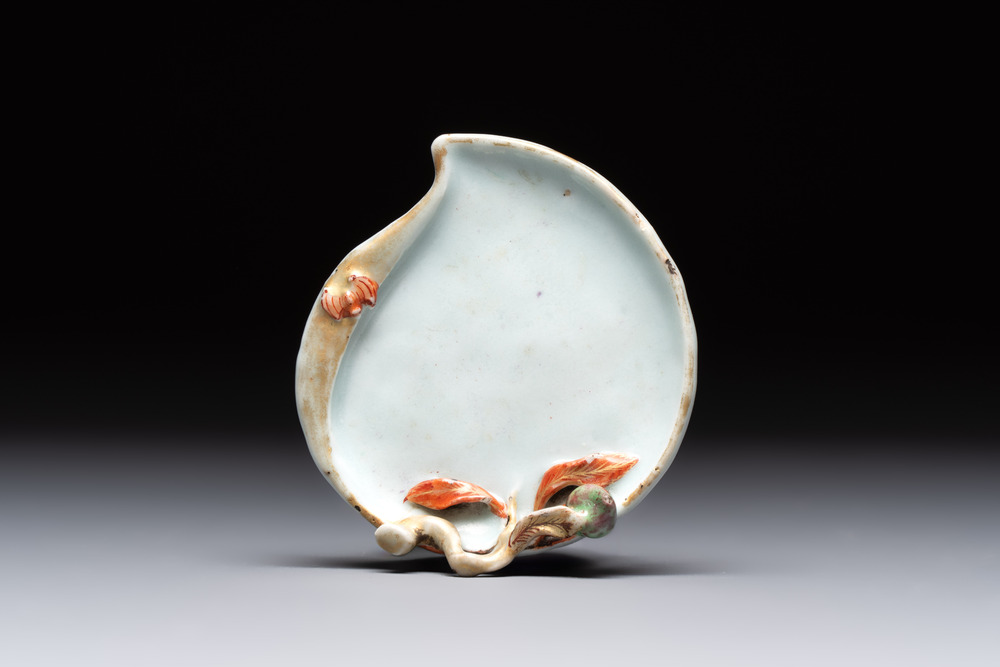 A Chinese iron-red gilt-decorated celadon-glazed peach-shaped brushwasher, 18th C.