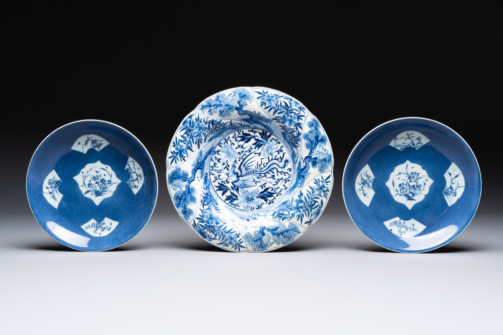 A Chinese blue and white 'phoenix and monkeys' dish and a pair of powder-blue-ground plates, Kangxi/Yongzheng