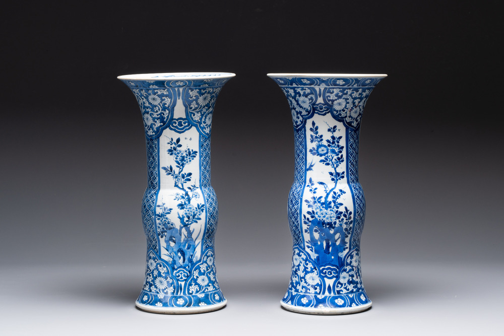 A pair of Chinese blue and white 'gu' vases with floral design, Kangxi