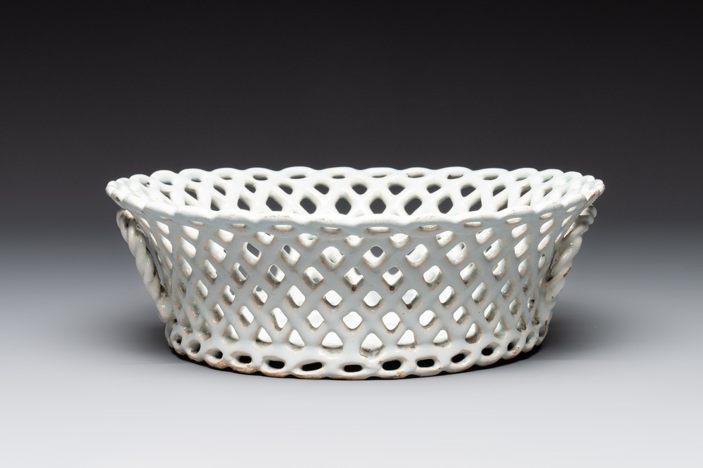 A round white-glazed reticulated pottery basket, Brussels or France, 18th C.