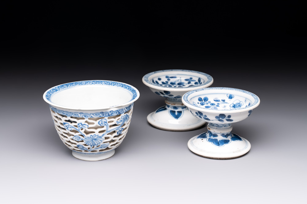 A pair of Chinese blue and white salts and a reticulated double-walled cup, Kangxi