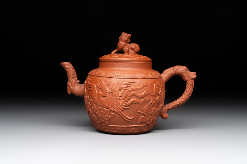 A Chinese Yixing stoneware 'phoenixes and peonies' teapot and cover, Kangxi