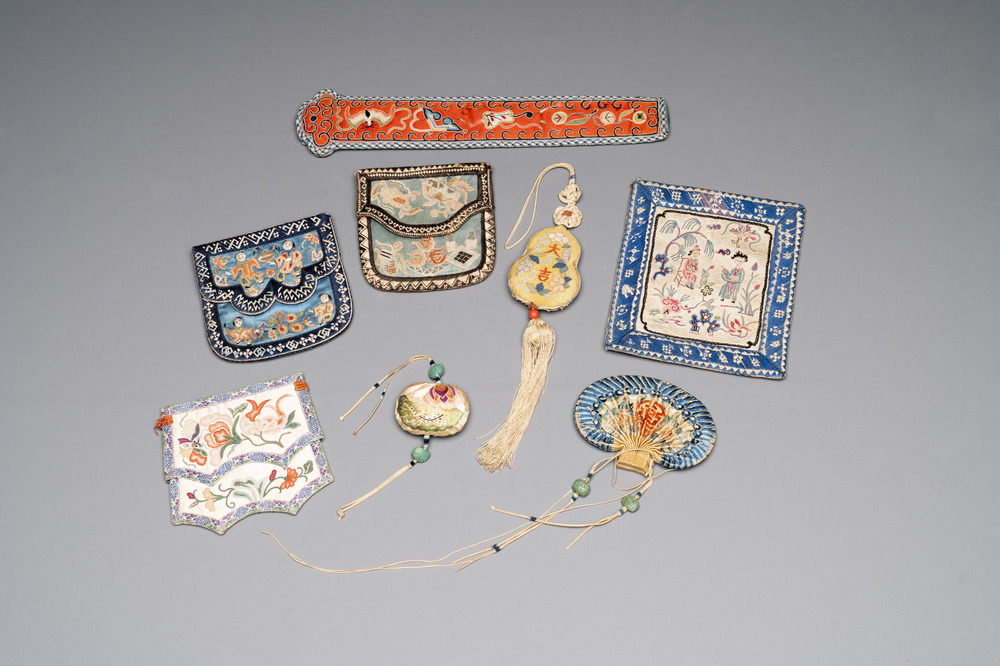 Eight Chinese embroidered silk pouches, 19th C.