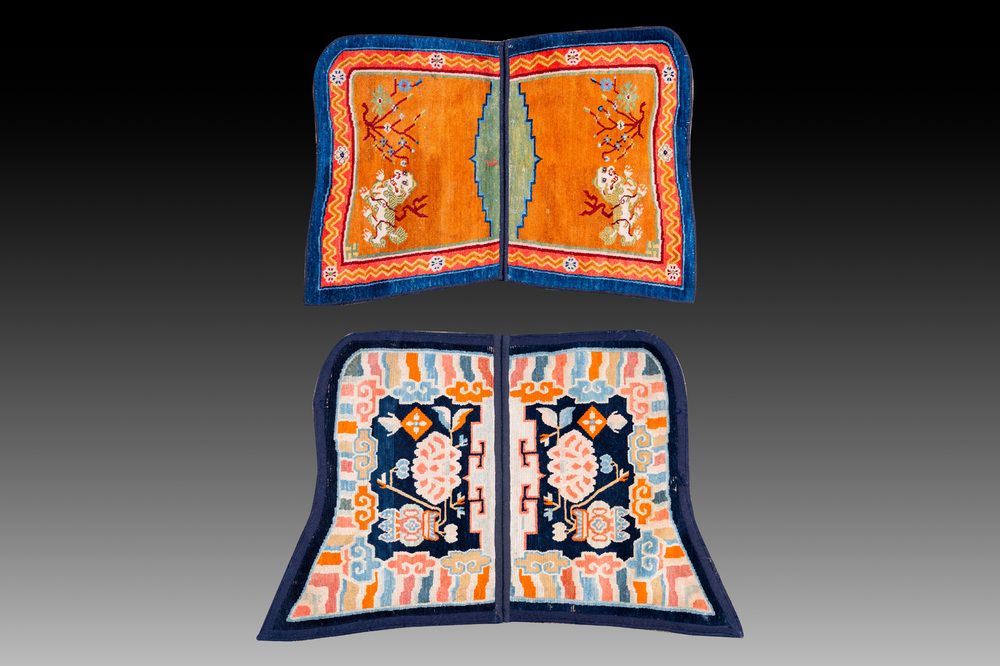 Two Tibetan saddle rugs with Buddhist lions and antiquities, 19th C.