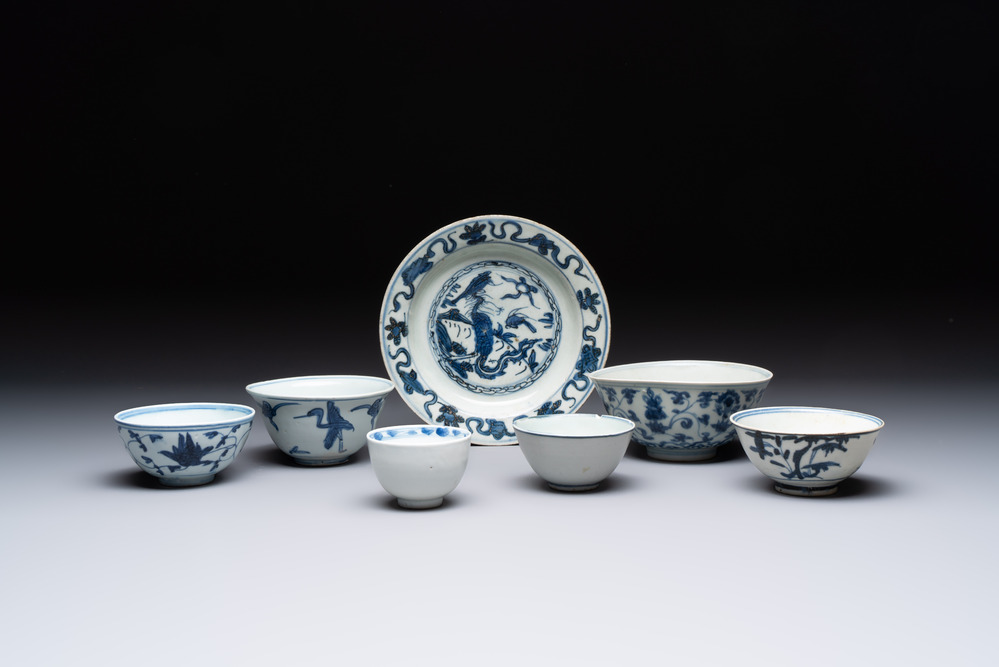 Four Chinese blue and white bowls, two cups and a plate, Ming
