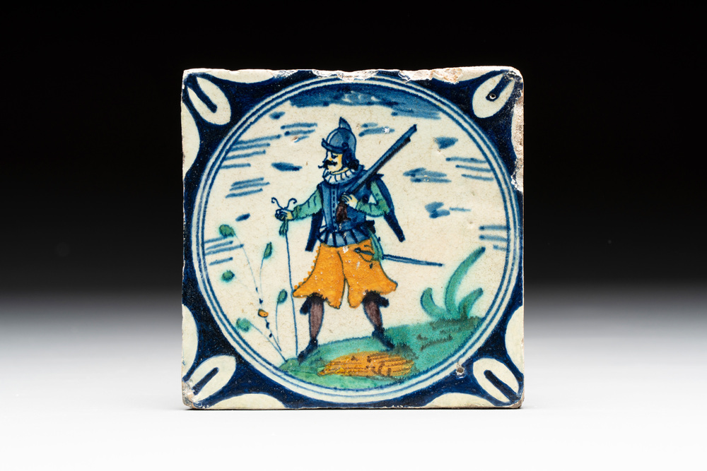 A polychrome Dutch Delft maiolica 'soldier' medallion tile, late 16th C.