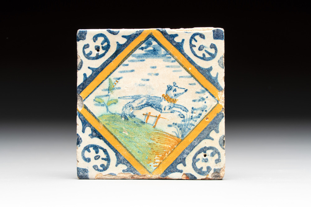 A small polychrome Dutch Delft maiolica 'dog' diamond tile, late 16th C.