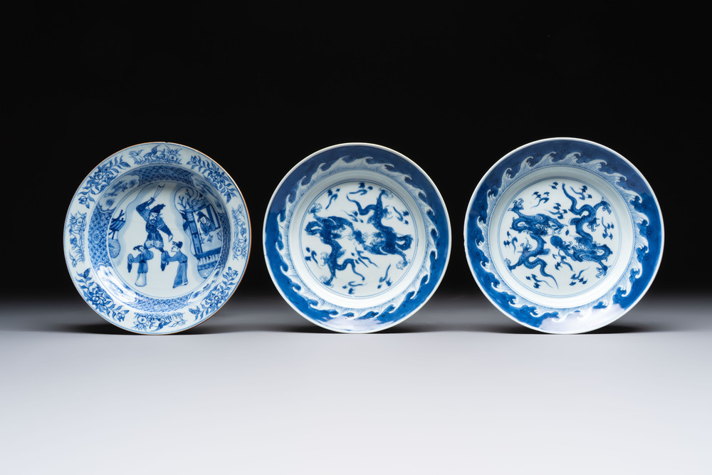 A pair of Chinese blue and white 'dragon' plates and a plate with narrative design, Yuzhen mark, Kangxi/Yongzheng