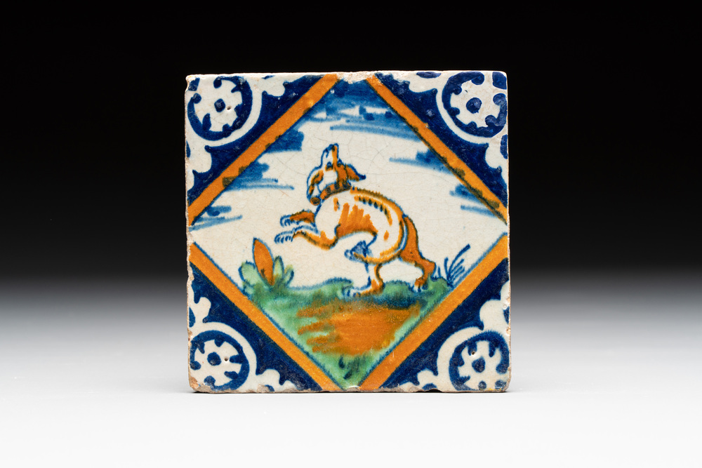 A polychrome Dutch Delft maiolica 'dog' diamond tile, late 16th C.